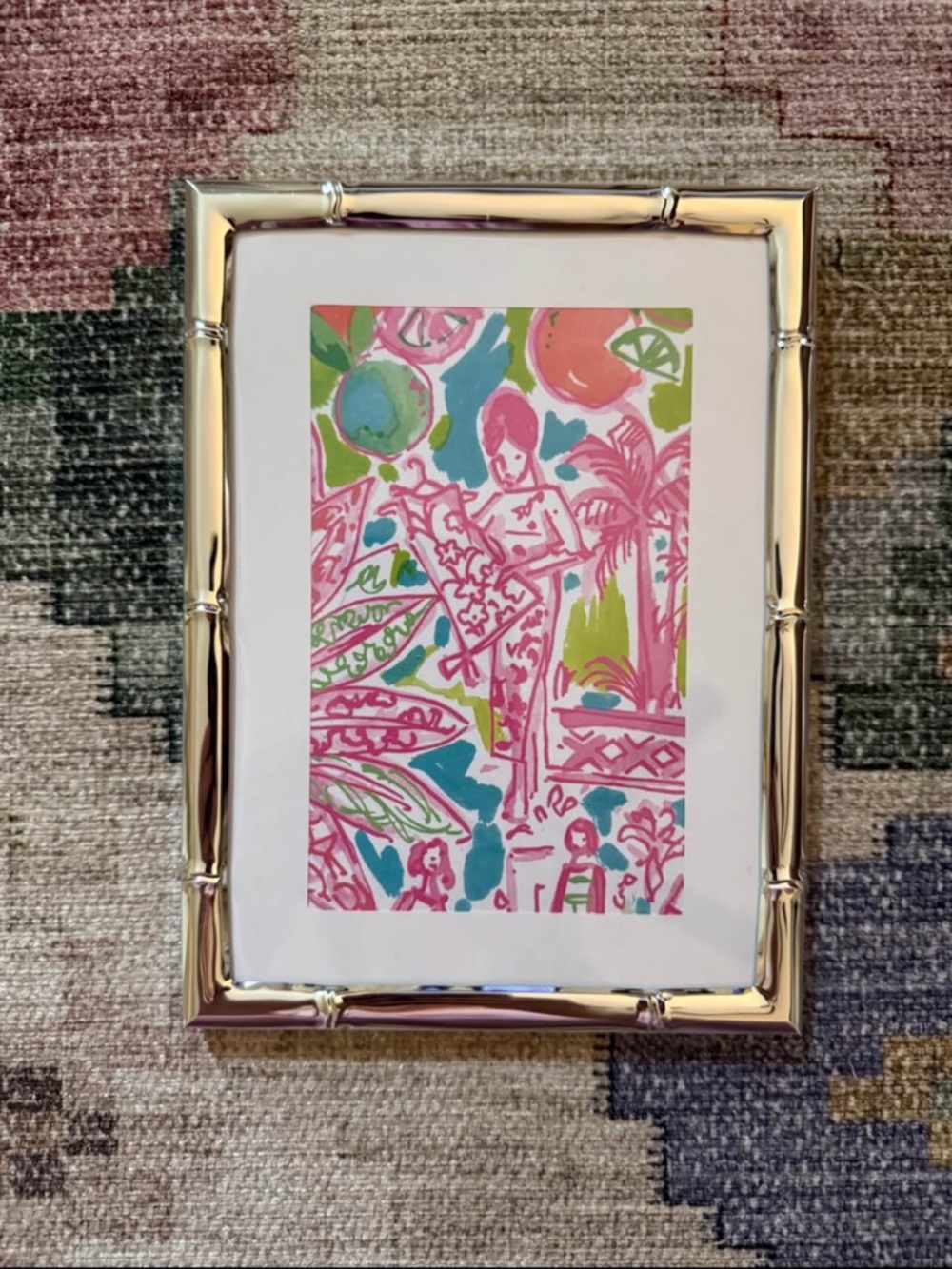 Lilly Pulitzer "Lilly" print in silver bamboo frame.
Measures 5"x7"